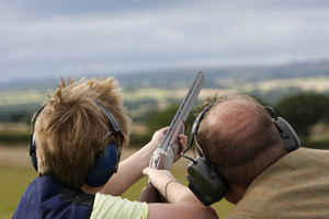 Man shooting with blue sky